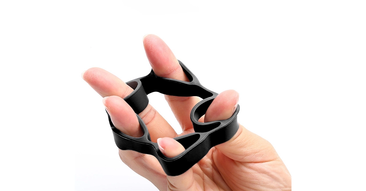 Person -performing -finger- dexterity -exercises- using -a -stress -ball-resistance -band-and-finger -stretching -techniques